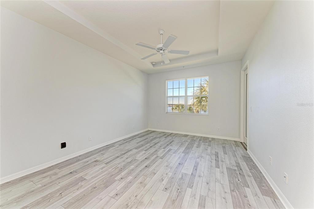 1246 Riverscape Street Bradenton, FL 34208 - Photo 30 of 68 wooden floor in an empty room with a window