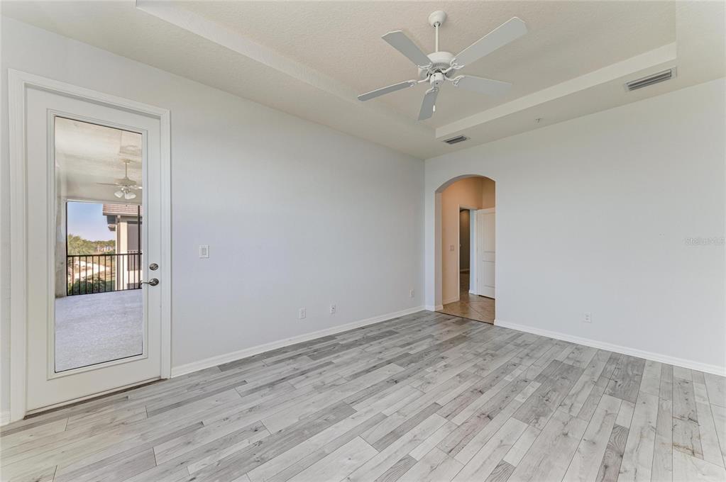 1246 Riverscape Street Bradenton, FL 34208 - Photo 32 of 68 an empty room with fan and entrance