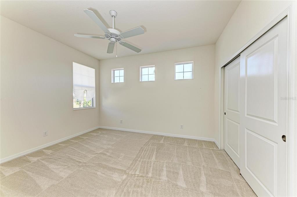 1246 Riverscape Street Bradenton, FL 34208 - Photo 41 of 68 an empty room with fan and windows