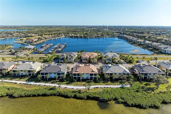 a view of a patio with table and chairs with wooden floor and fence