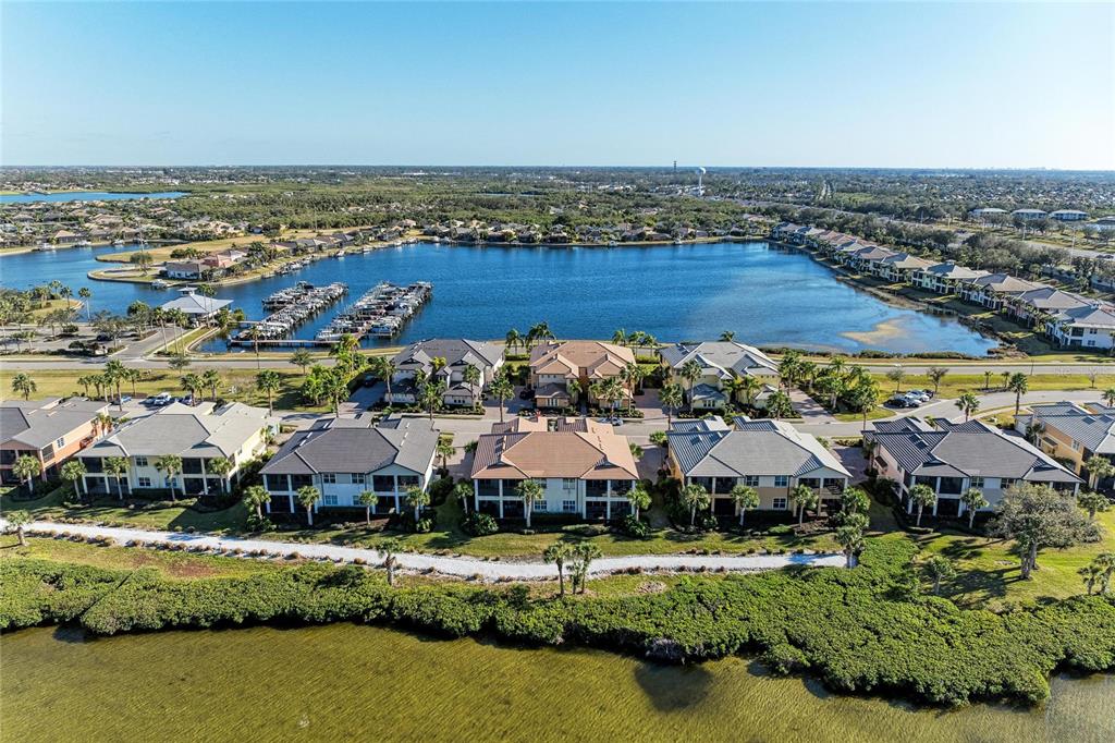 1246 Riverscape Street Bradenton, FL 34208 - Photo 48 of 68 an aerial view of residential houses with outdoor space and river