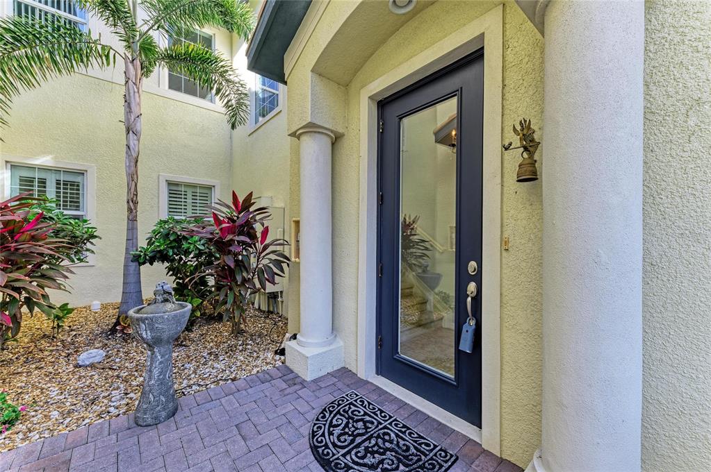 1246 Riverscape Street Bradenton, FL 34208 - Photo 6 of 68 a view of a hallway with wooden floor and a potted plant