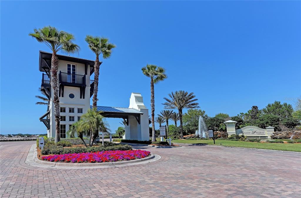 1246 Riverscape Street Bradenton, FL 34208 - Photo 68 of 68 a vase of flowers sitting on a floor