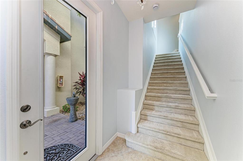 1246 Riverscape Street Bradenton, FL 34208 - Photo 8 of 68 a view of a hallway with wooden floor and entryway