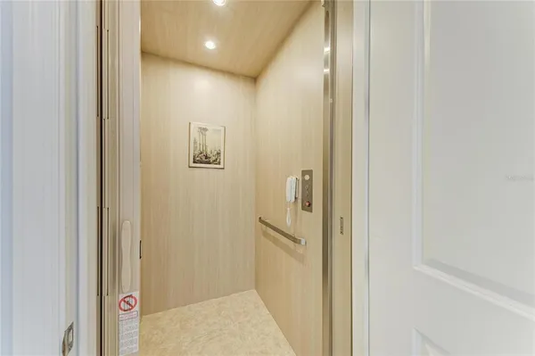 a view of a hallway with two rooms