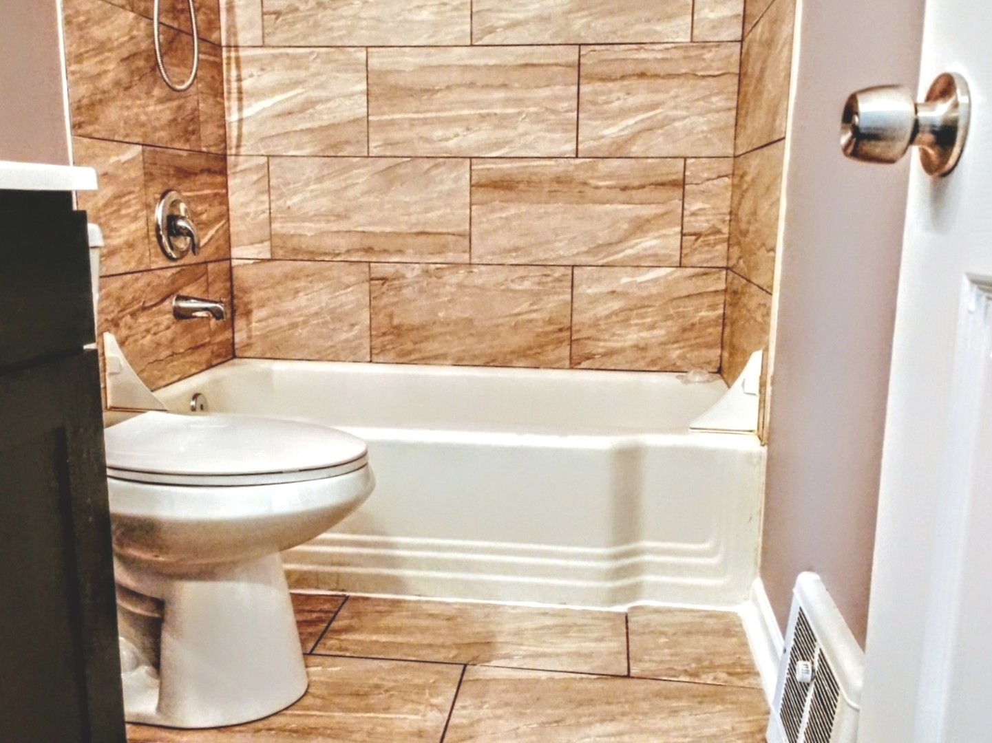 371 South Edison Avenue Elgin, IL 60123 - Photo 8 of 32 a bathroom with a toilet and a shower