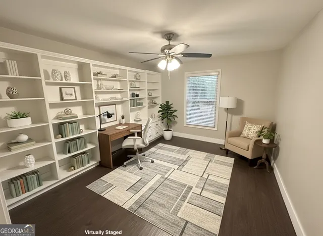 a view of a livingroom with furniture and a window