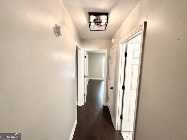 a bedroom with a bed ceiling fan and a window