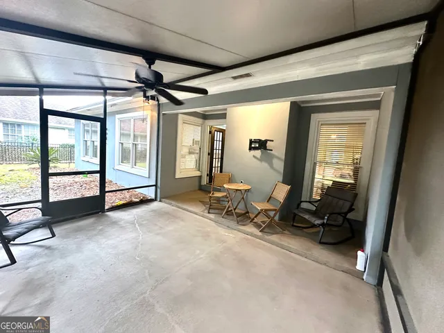 a sign that is on a wall next to a road