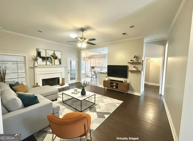 a living room with furniture fireplace and a flat screen tv