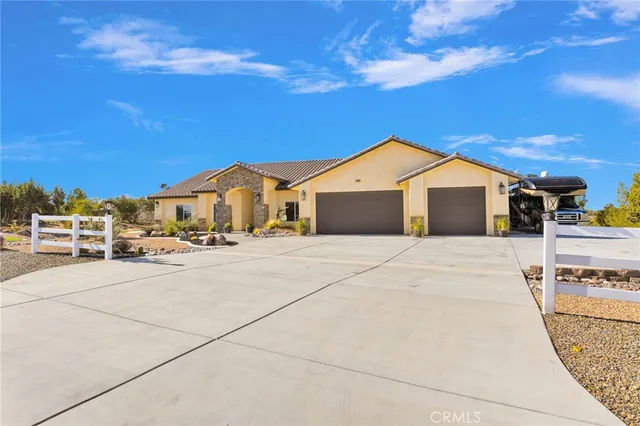 a view of a brick house with potted plants