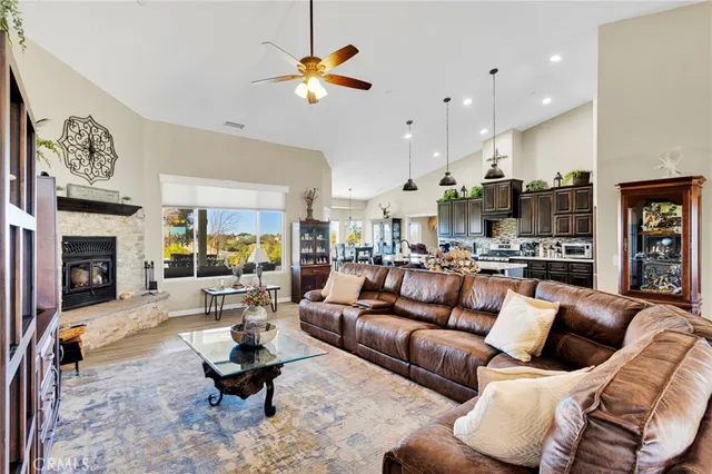 a living room with furniture a air conditioner vent and a window