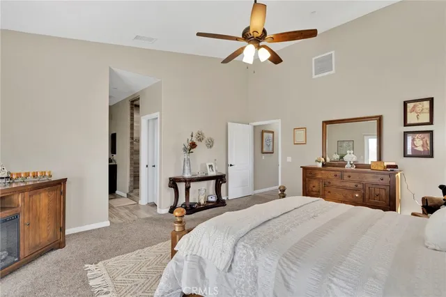 a bathroom with a granite countertop sink a mirror and shower