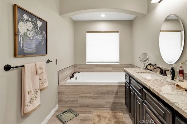 a bathroom with a bathtub and shower
