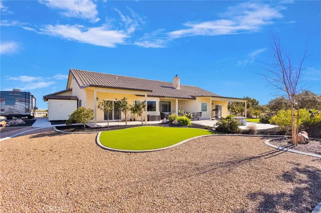 an aerial view of a house with a swimming pool