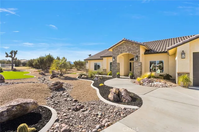 a view of a livingroom with furniture and a chandelier