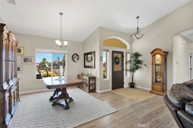 a view of a livingroom with furniture window and wooden floor