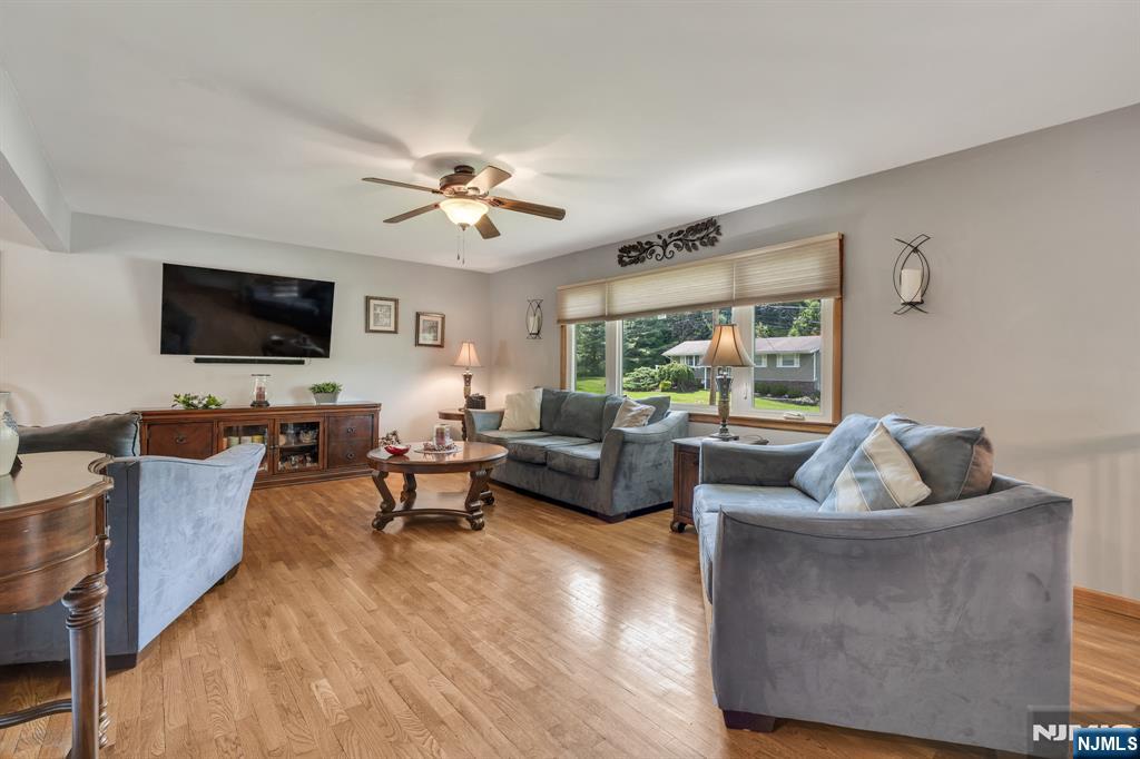 55 Marcia Road Ringwood, NJ 07456 - Photo 9 of 42 a living room with furniture and a flat screen tv