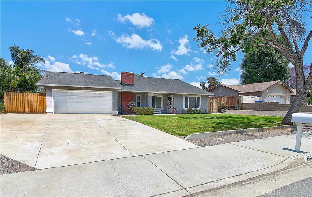 2815 Cimarron Road Riverside, CA 92506 - Photo 1 of 1 a front view of a house with a yard and garage