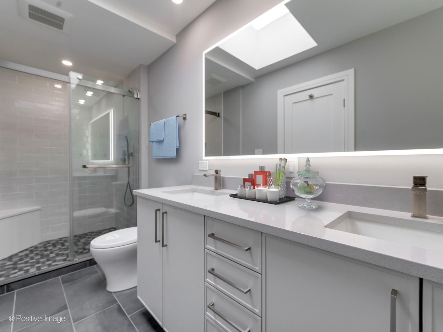 1114 West Altgeld Street, Unit A2 Chicago, IL 60614 - Photo 11 of 19 a bathroom with a granite countertop sink a toilet and shower