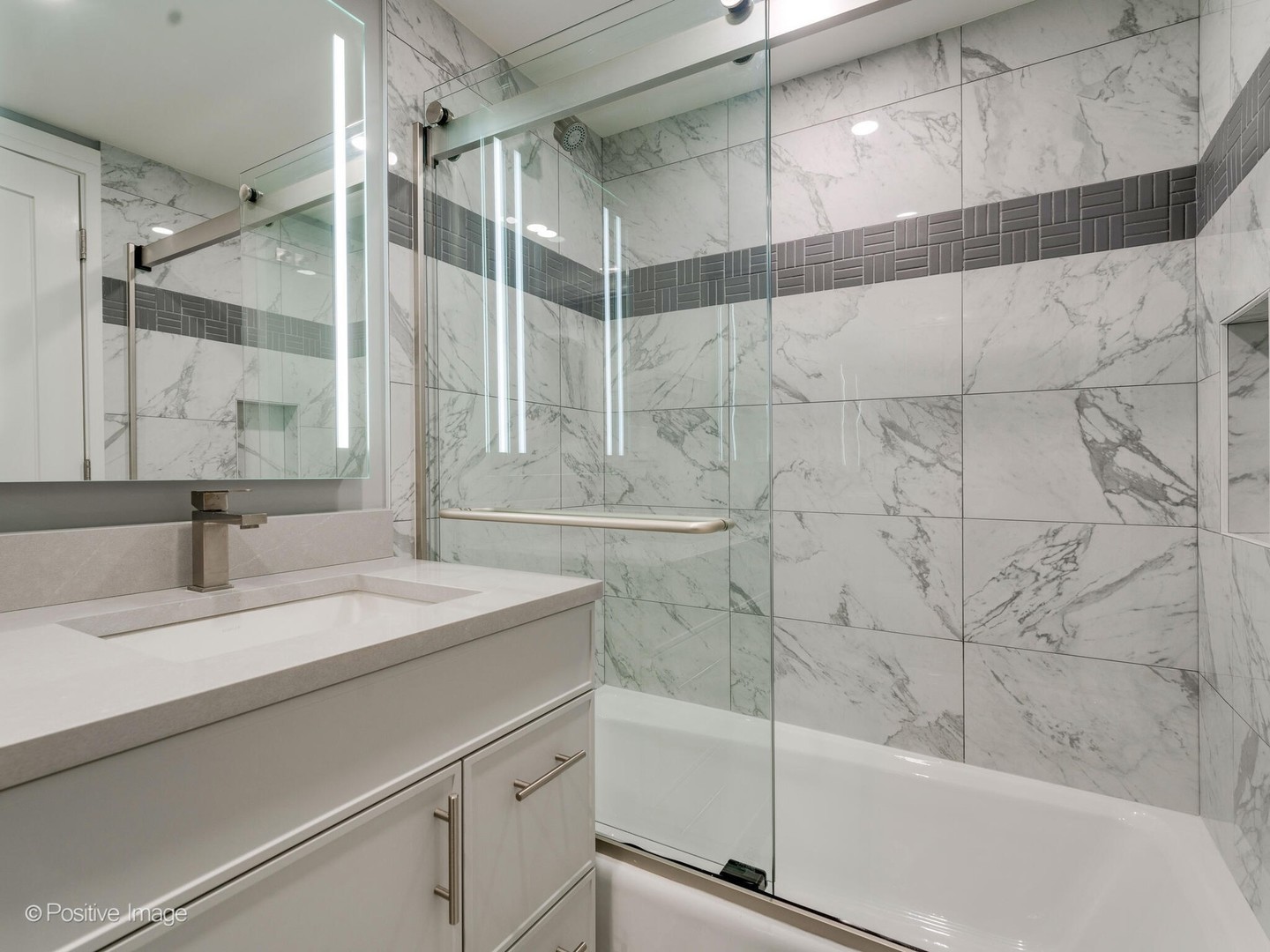 1114 West Altgeld Street, Unit A2 Chicago, IL 60614 - Photo 16 of 19 a bathroom with a sink and a mirror