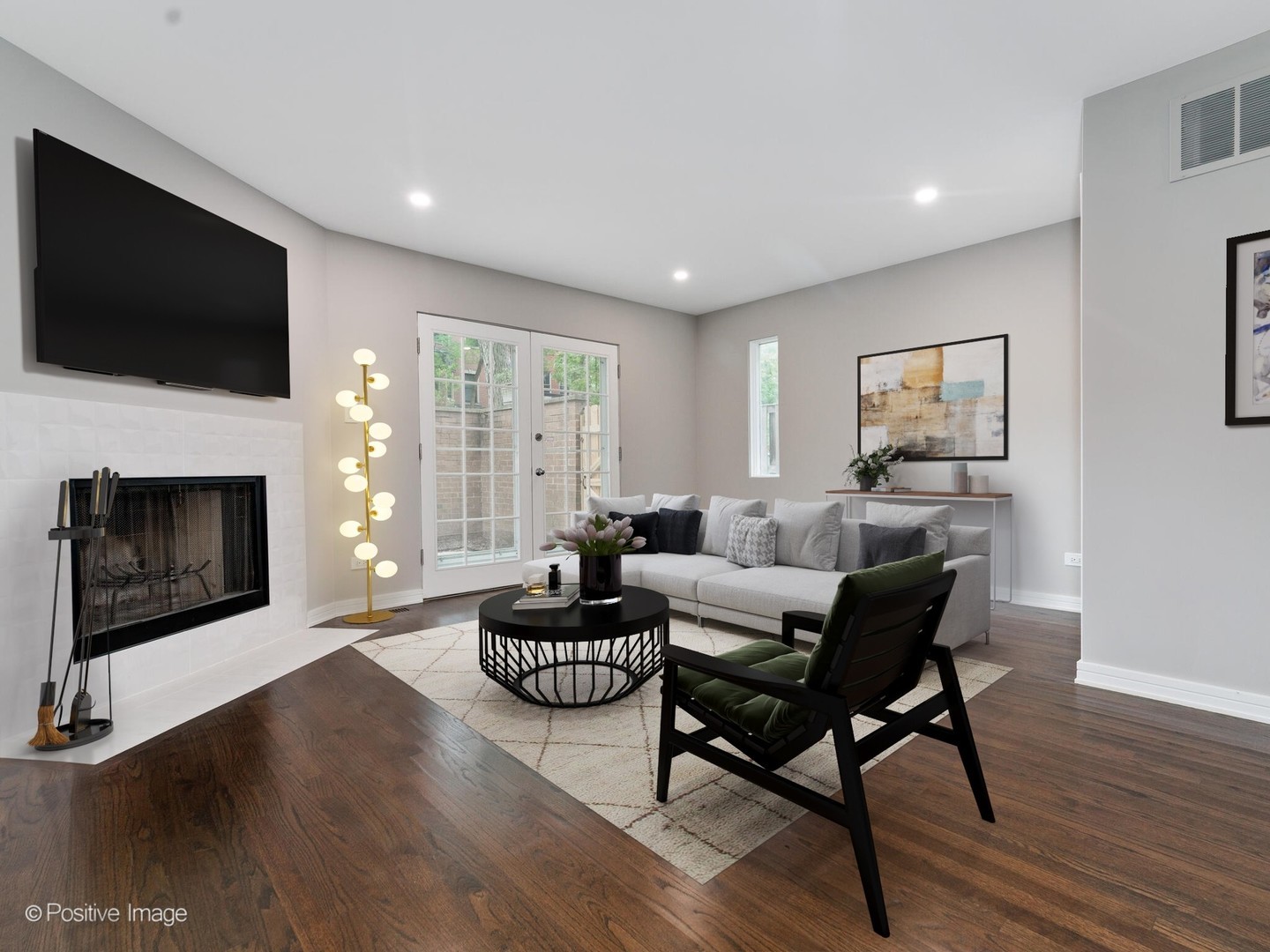 1114 West Altgeld Street, Unit A2 Chicago, IL 60614 - Photo 2 of 19 a living room with furniture a flat screen tv and a fireplace