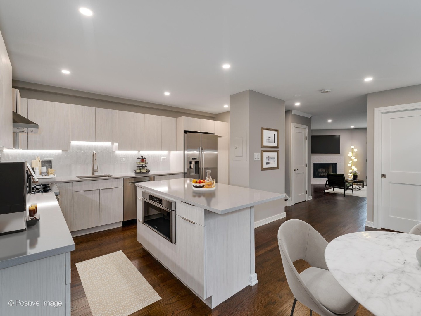1114 West Altgeld Street, Unit A2 Chicago, IL 60614 - Photo 5 of 19 a open kitchen with cabinets a sink and appliances