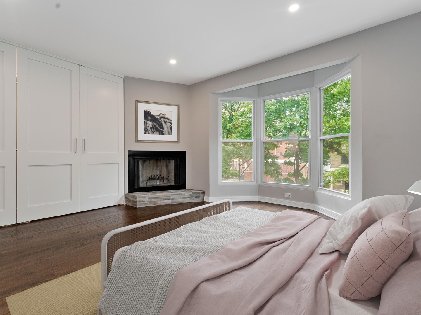 1114 West Altgeld Street, Unit A2 Chicago, IL 60614 - Photo 10 of 19 a bedroom with a bed and a fireplace