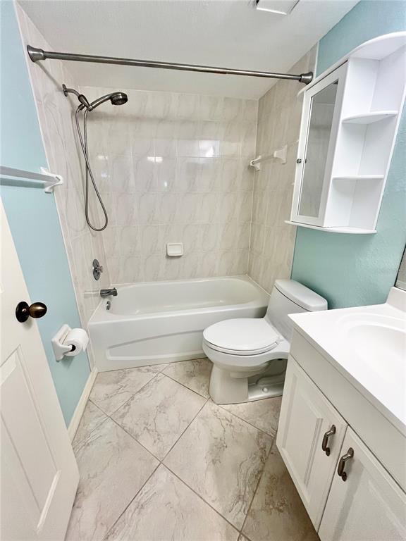 175 Kings Highway, Unit 236 Punta Gorda, FL 33983 - Photo 17 of 26 a bathroom with a sink a toilet and a bathtub