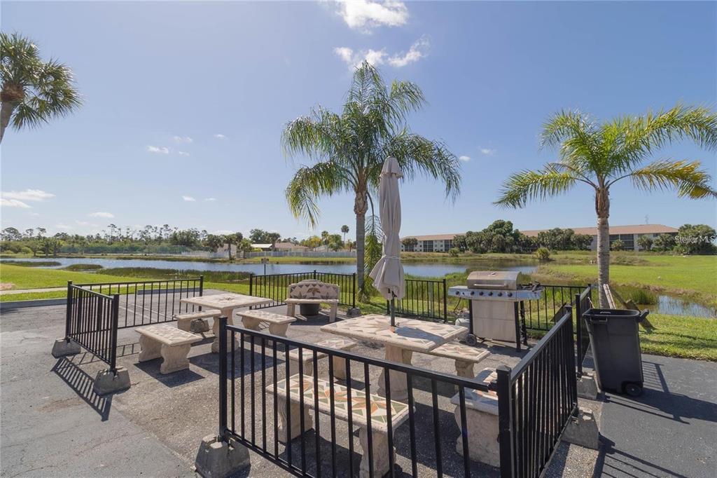 175 Kings Highway, Unit 236 Punta Gorda, FL 33983 - Photo 24 of 26 a patio with water view fountain and a lake view