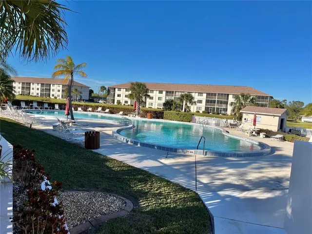a view of a swimming pool with a patio