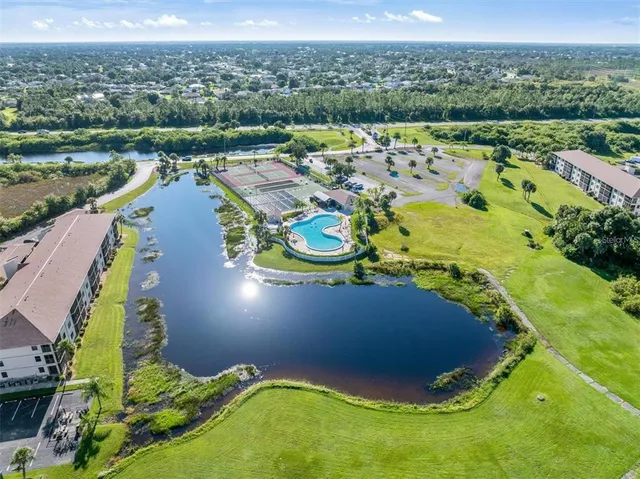 an aerial view of a house with a lake view