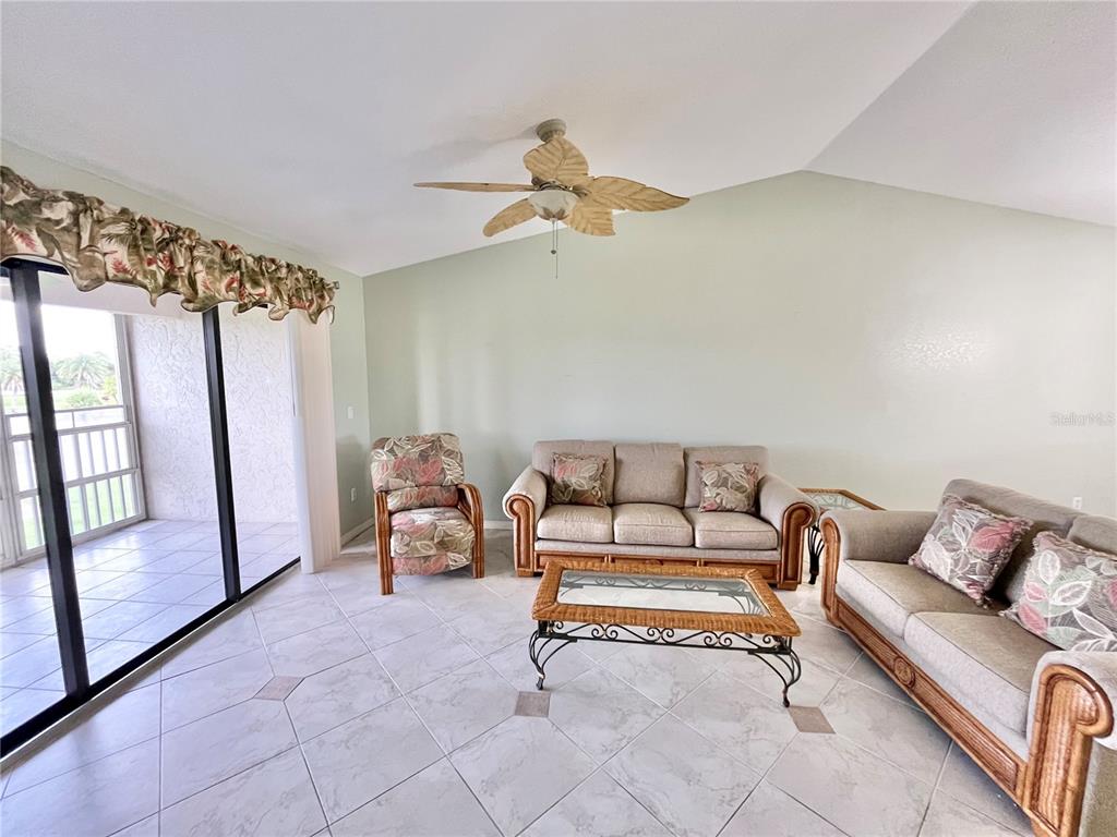 175 Kings Highway, Unit 236 Punta Gorda, FL 33983 - Photo 10 of 26 a living room with furniture and a window