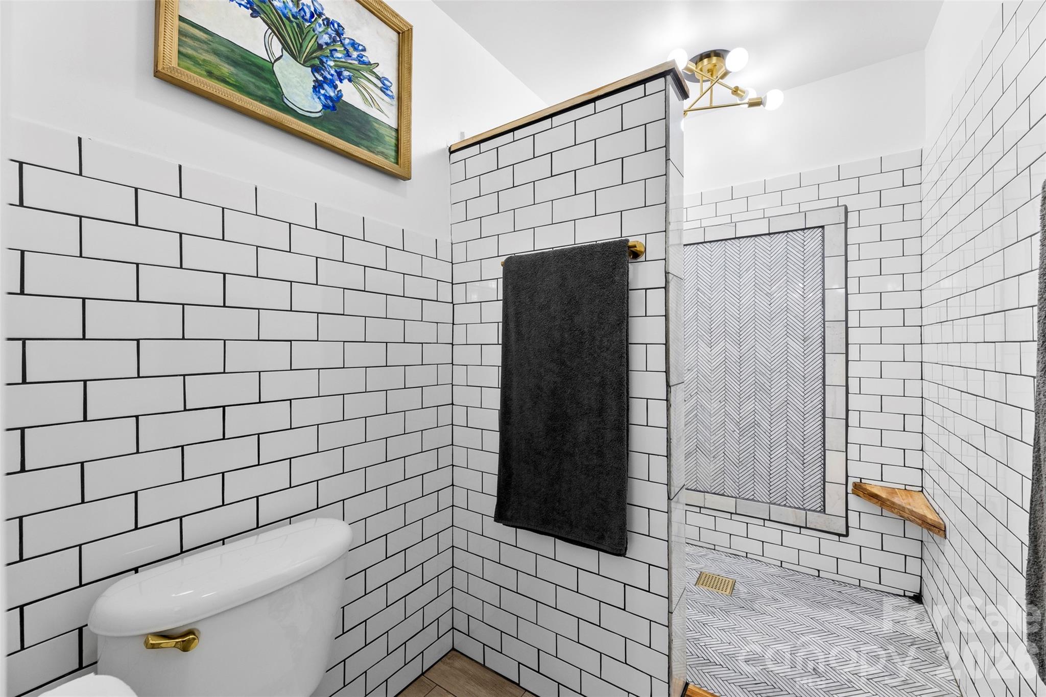 7901 McConnell Road Denver, NC 28037 - Photo 14 of 27 a bathroom with a shower and toilet