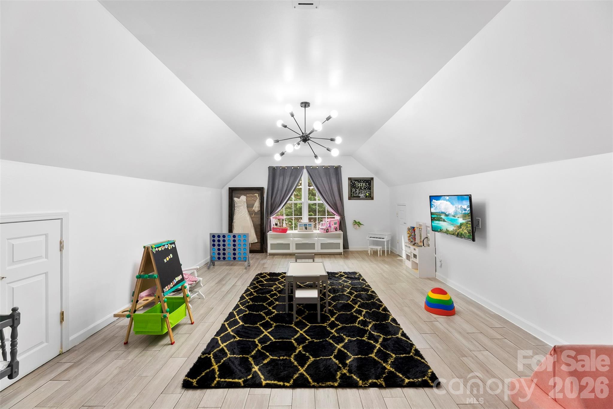 7901 McConnell Road Denver, NC 28037 - Photo 20 of 27 a kitchen with a stove and a wooden floor