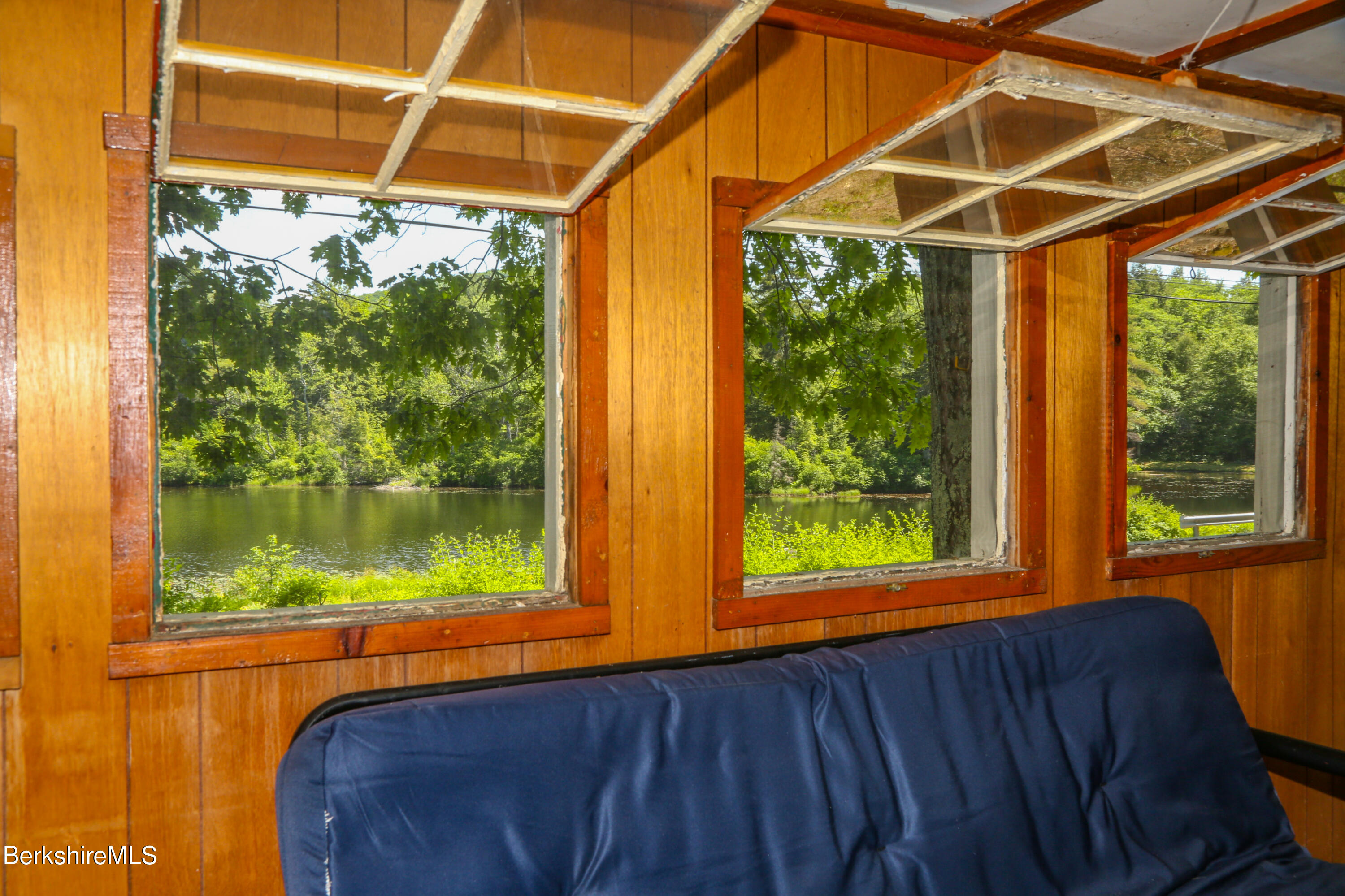 50 Pond Road Rowe, MA 01367 - Photo 11 of 17 a view of a room with wooden floor and a porch
