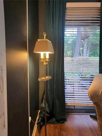 a view of a living room and kitchen with furniture