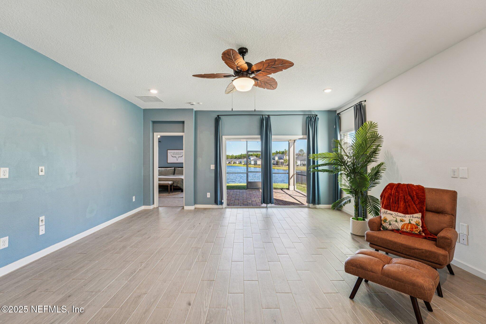 428 Lake Sinclair Street St. Augustine, FL 32084 - Photo 11 of 72 a living room with furniture and a large window