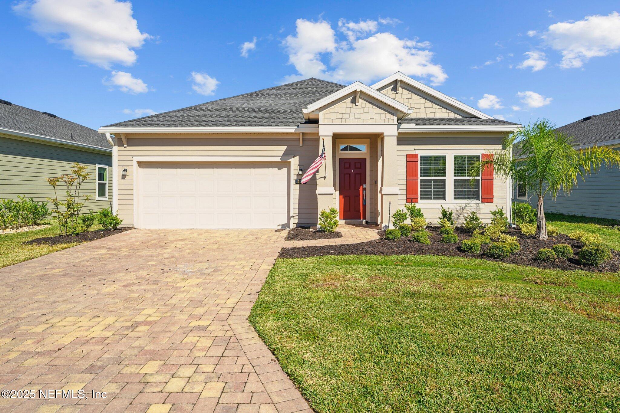 428 Lake Sinclair Street St. Augustine, FL 32084 - Photo 2 of 72 a front view of a house with a yard