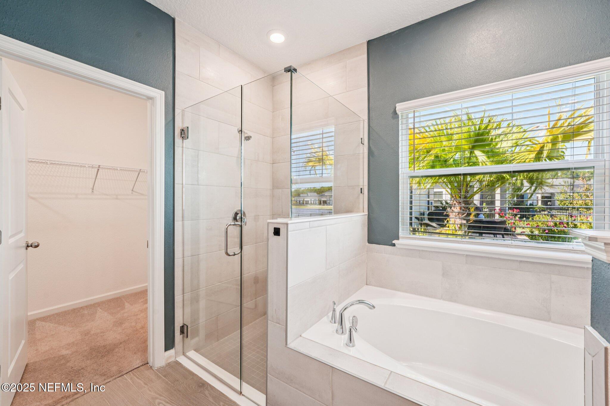 428 Lake Sinclair Street St. Augustine, FL 32084 - Photo 30 of 72 a bathroom with a bathtub and a shower