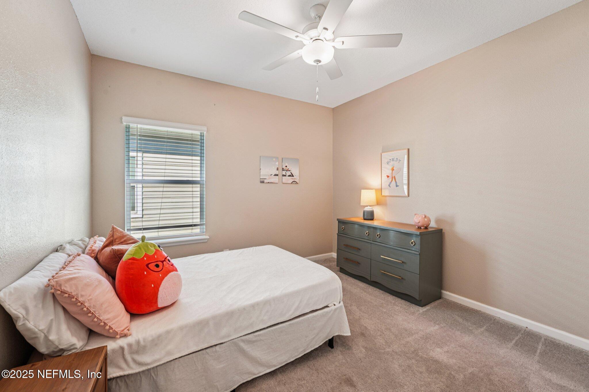 428 Lake Sinclair Street St. Augustine, FL 32084 - Photo 36 of 72 a bedroom with a bed and window