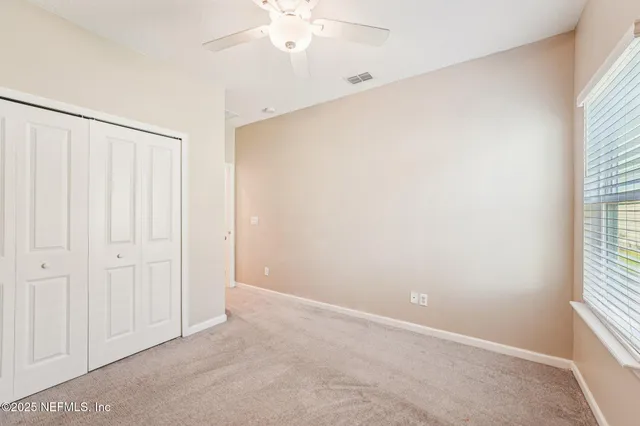 an aerial view of a house with a ocean view