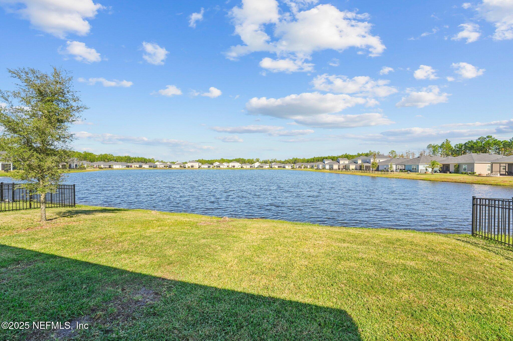 428 Lake Sinclair Street St. Augustine, FL 32084 - Photo 43 of 72 a view of a swimming pool and an outdoor seating