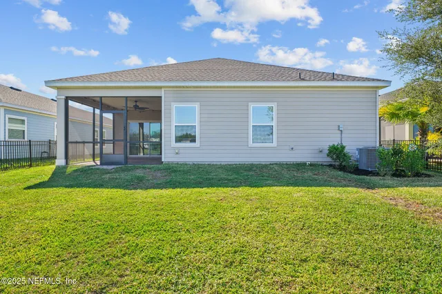 a bathroom with a sink mirror and bathtub