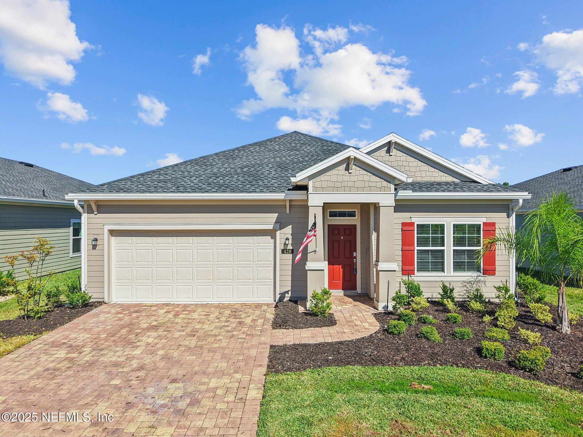 428 Lake Sinclair Street St. Augustine, FL 32084 - Photo 47 of 72 a front view of a house with garden