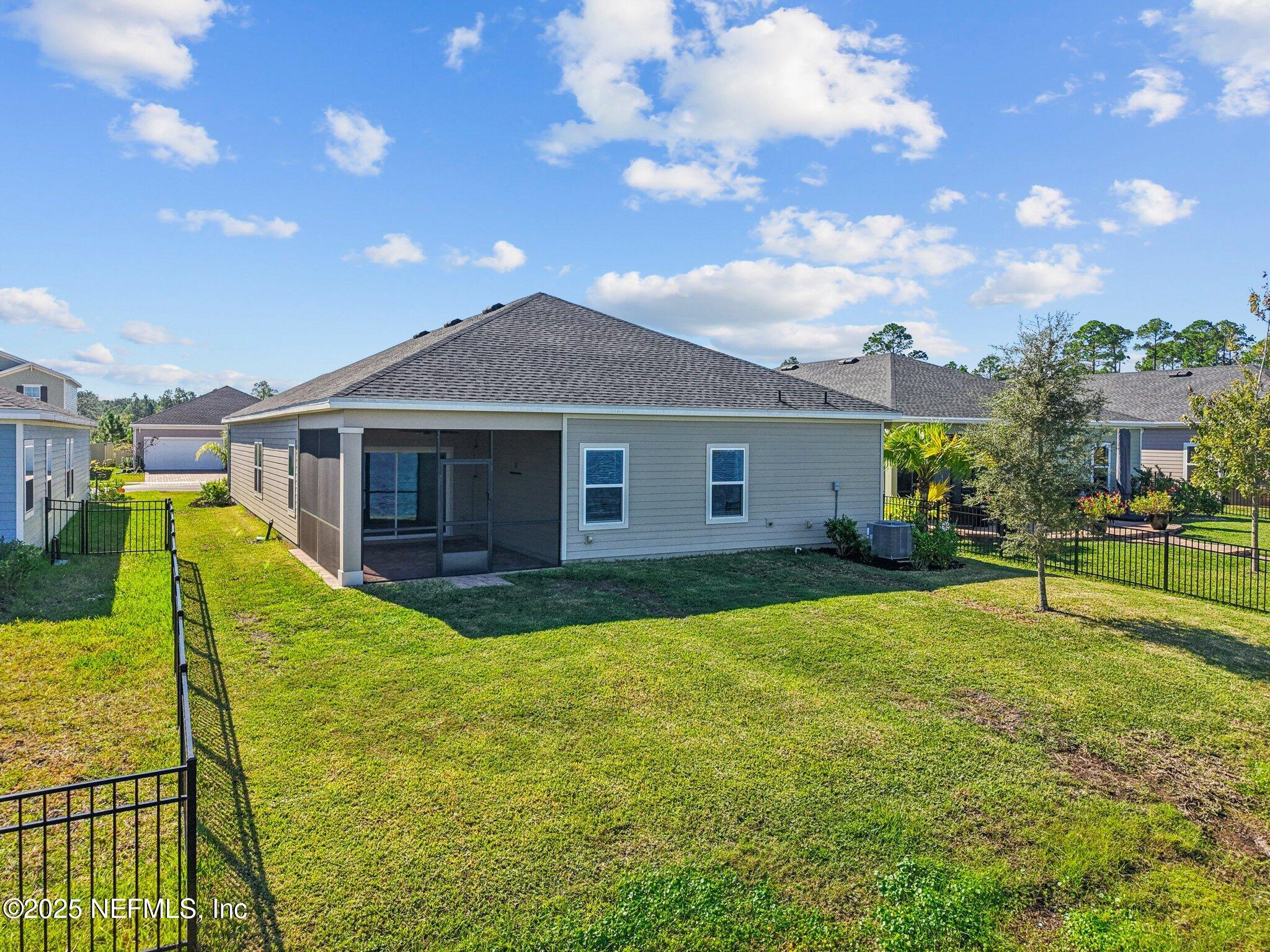 428 Lake Sinclair Street St. Augustine, FL 32084 - Photo 54 of 72 a view of a house with a big yard and potted plants