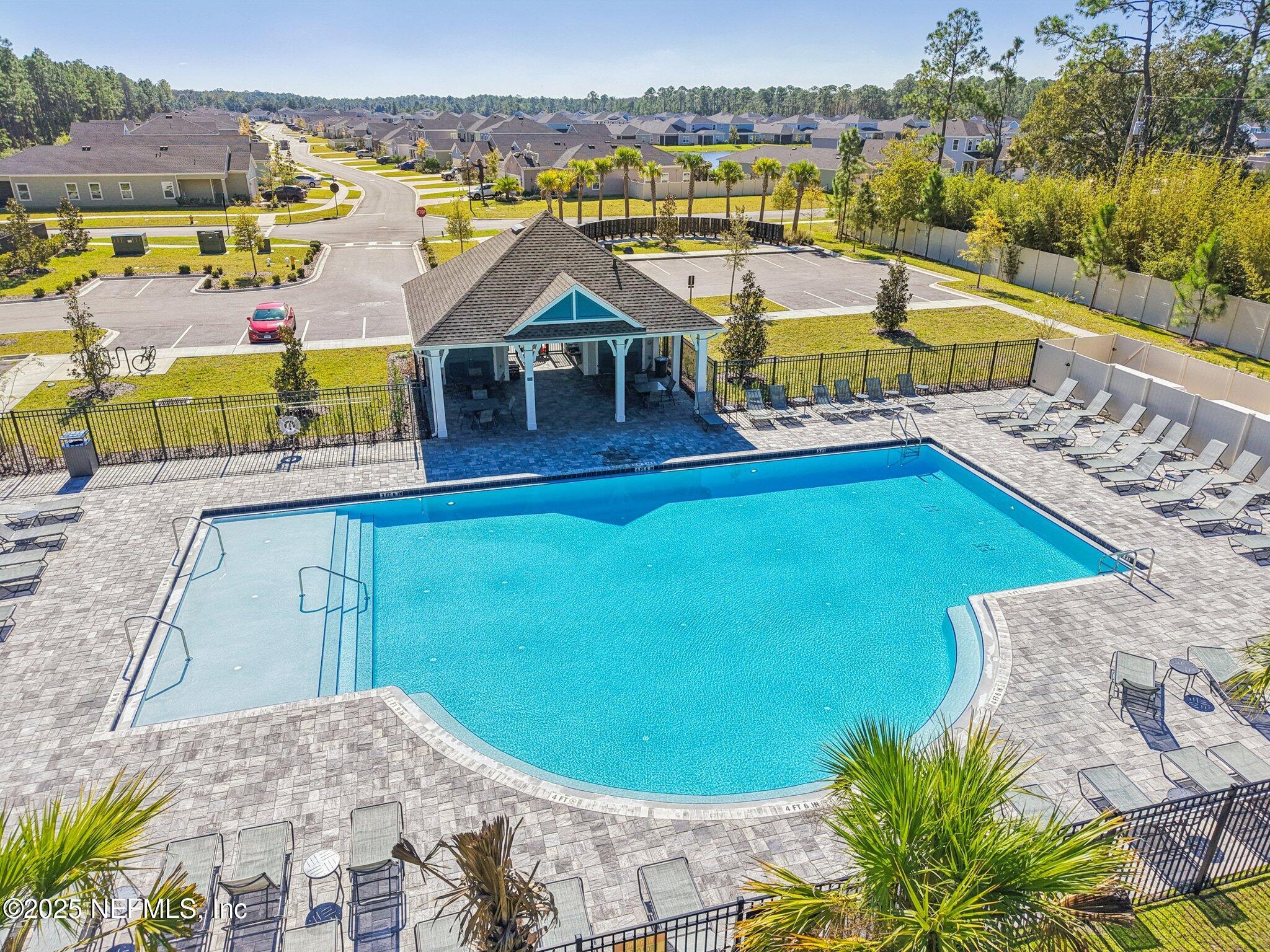 428 Lake Sinclair Street St. Augustine, FL 32084 - Photo 69 of 72 a view of a swimming pool with a lounge chairs