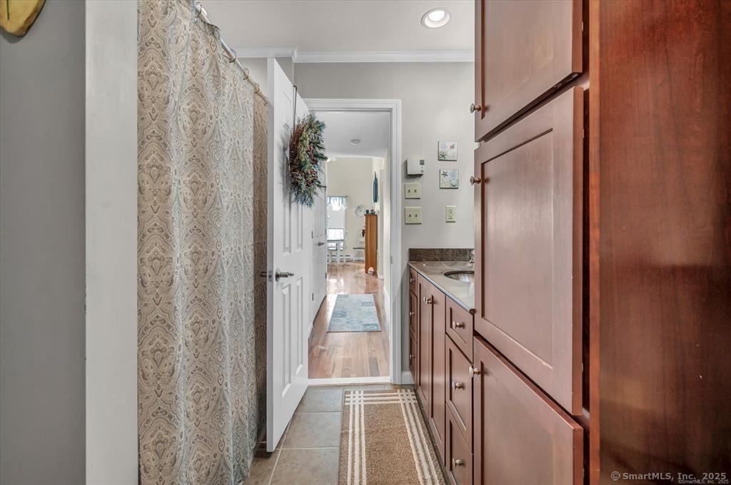 10 Pilgrims Harbor, Unit D Wallingford, CT 06492 - Photo 20 of 32 a view of a kitchen from the hallway