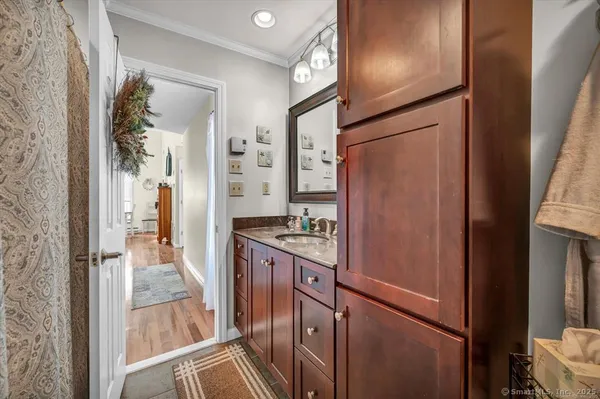 a kitchen with stainless steel appliances granite countertop cabinets and refrigerator