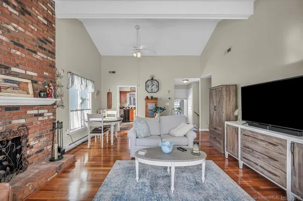 a living room with furniture and a flat screen tv
